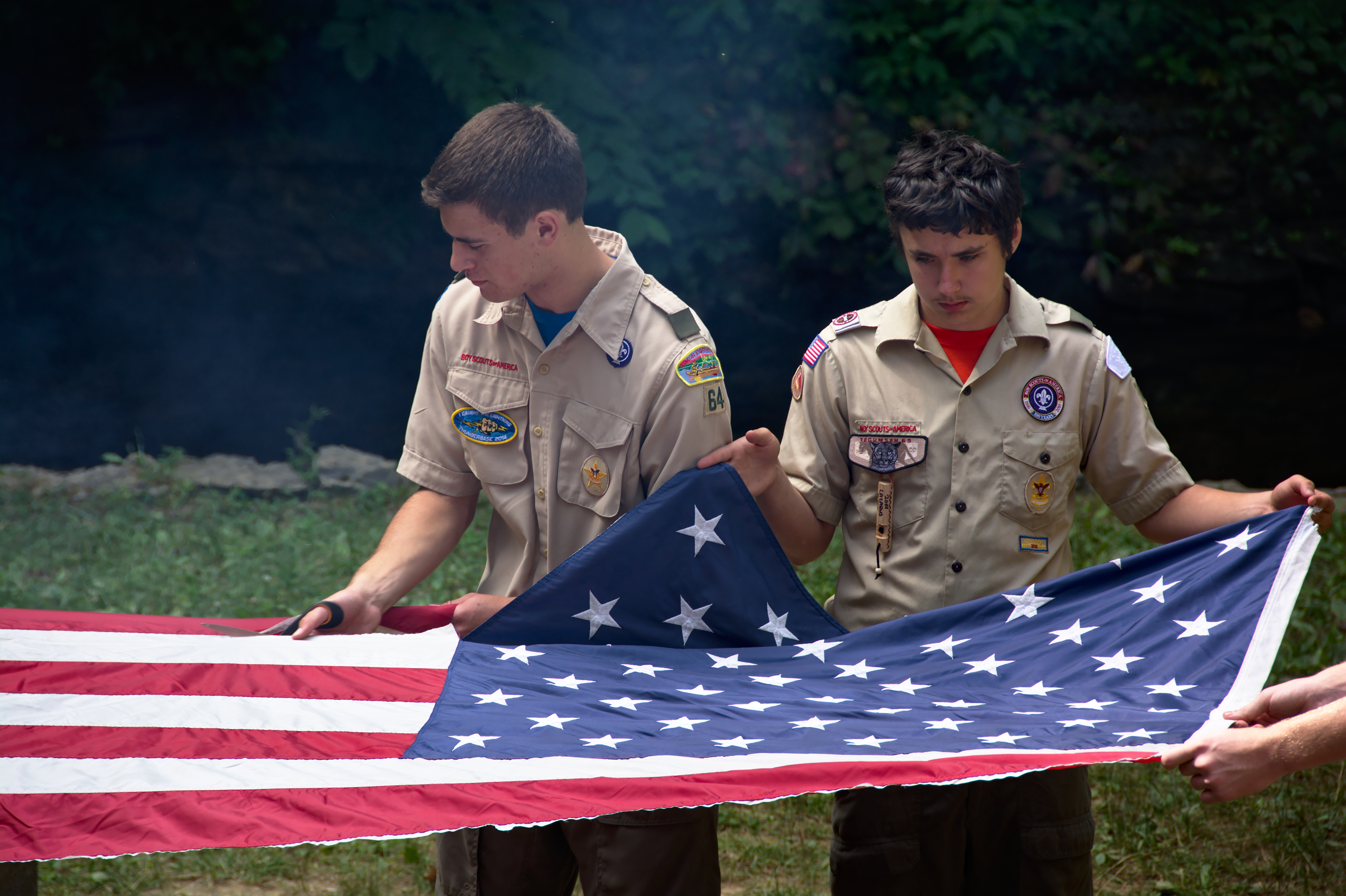 boy scouts holding american flag